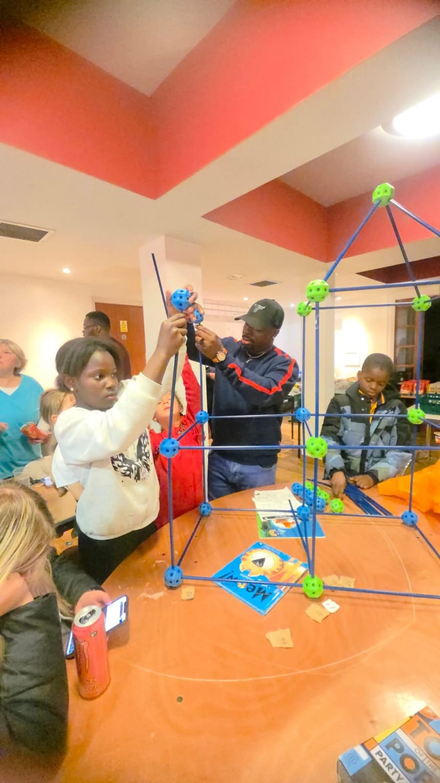 Man in yellow Mamacita Foundation vest at food distribution